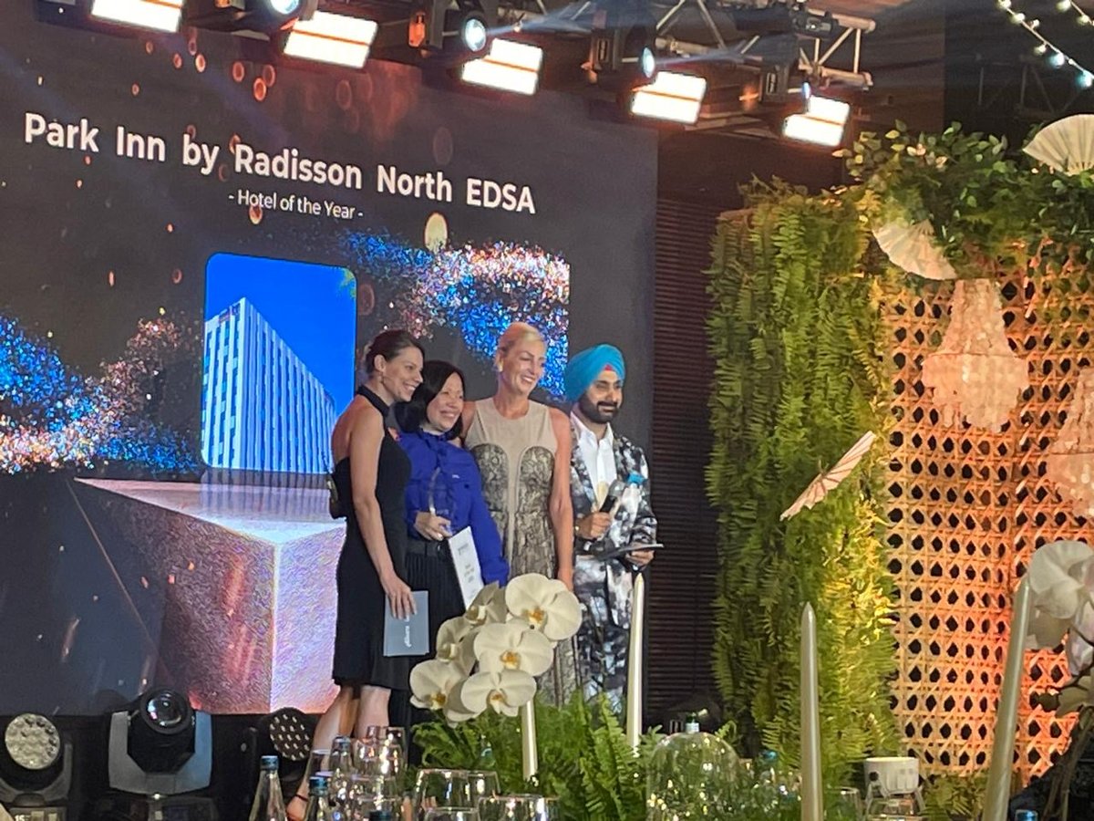 THE general manager receives the Hotel of the Year Award for Park Inn by Radisson North EDSA.